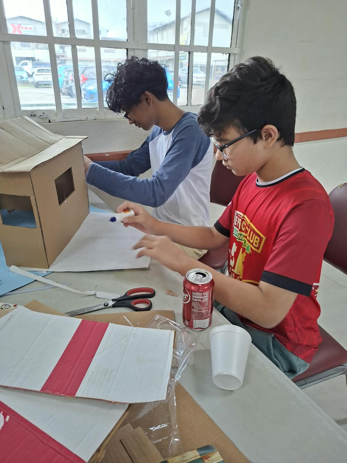 Students designing a cardboard challenge structure